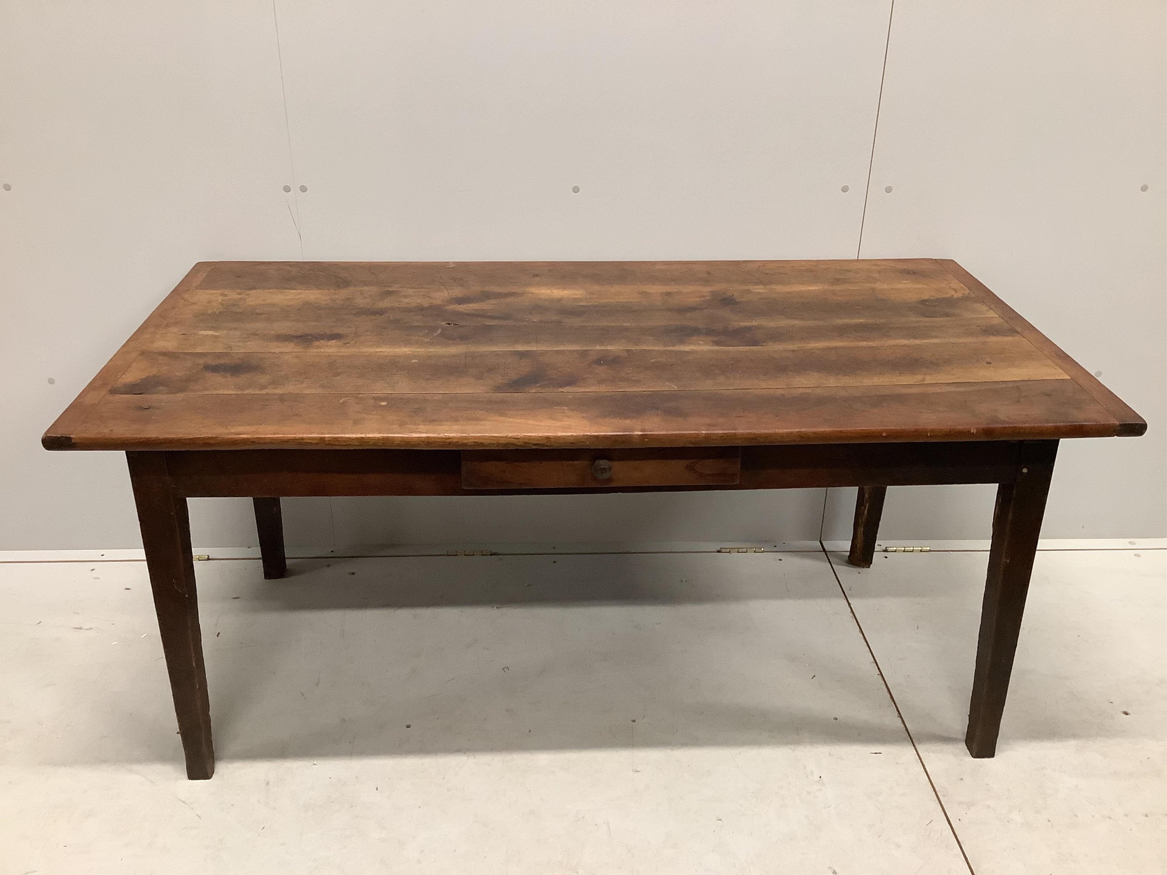 A 19th century French rectangular oak kitchen table, fitted drawer on square tapered legs, width 164cm, depth 83cm, height 72cm. Condition - fair, top with knot hole, all legs have losses due to old worm infestation, now